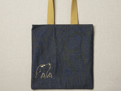 Front exterior of the reversible Dog Trace Tote bag.